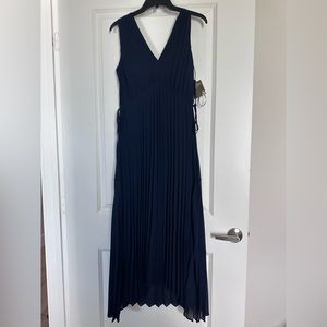 Brand new pleated dress, adjustable waist, front a bit shorter then the back